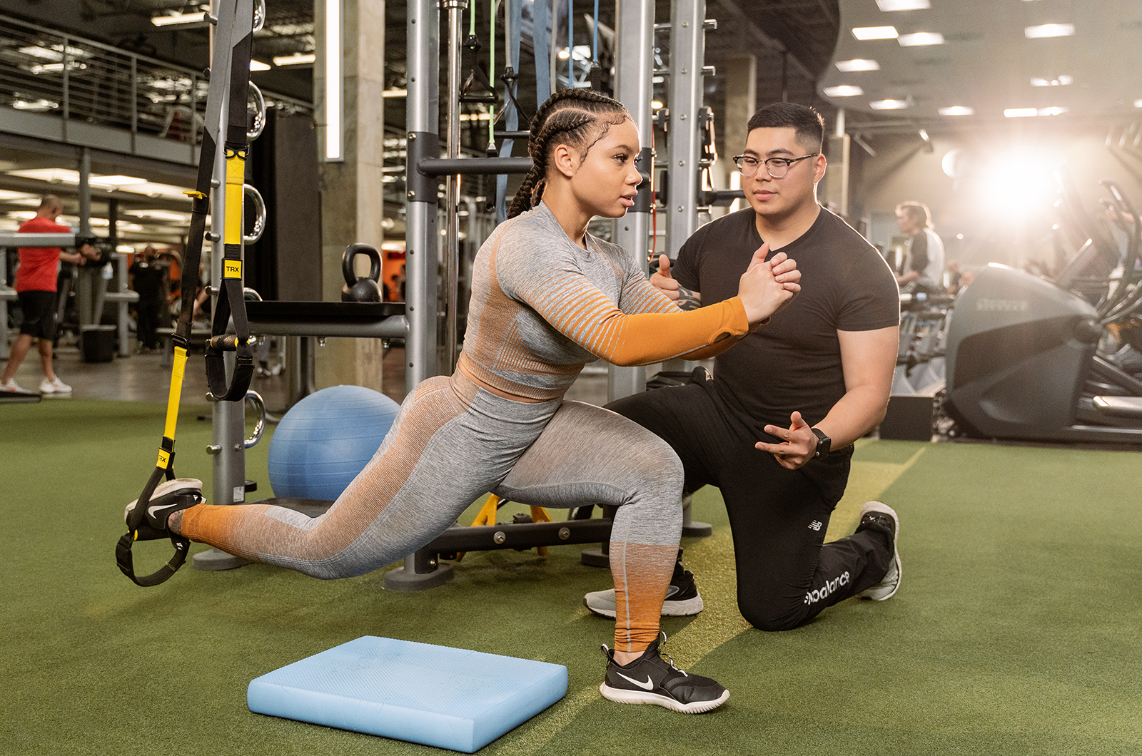 Personal trainer coaching a member at Onelife Fitness